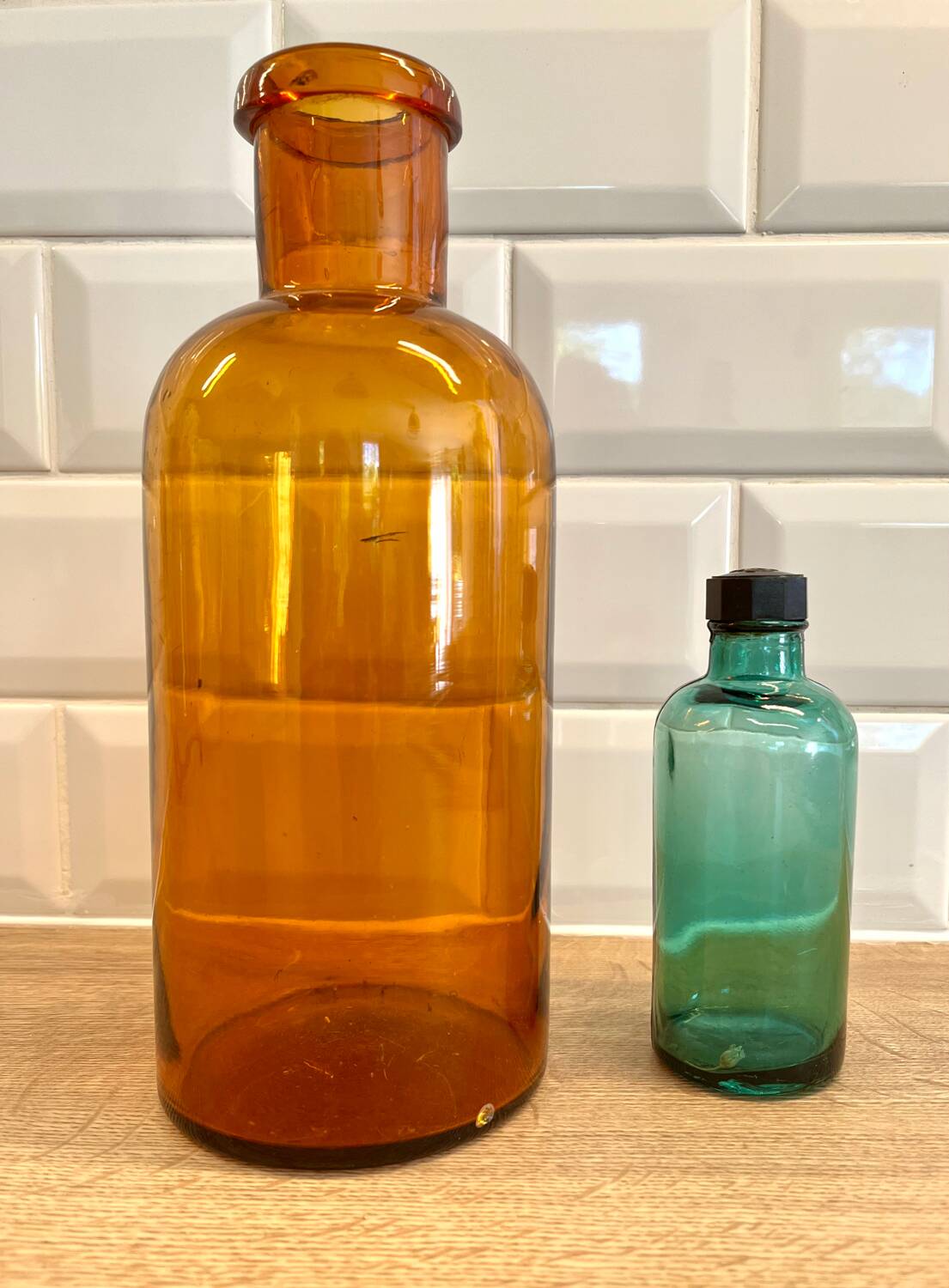 Small vintage dark turquoise blue bottle