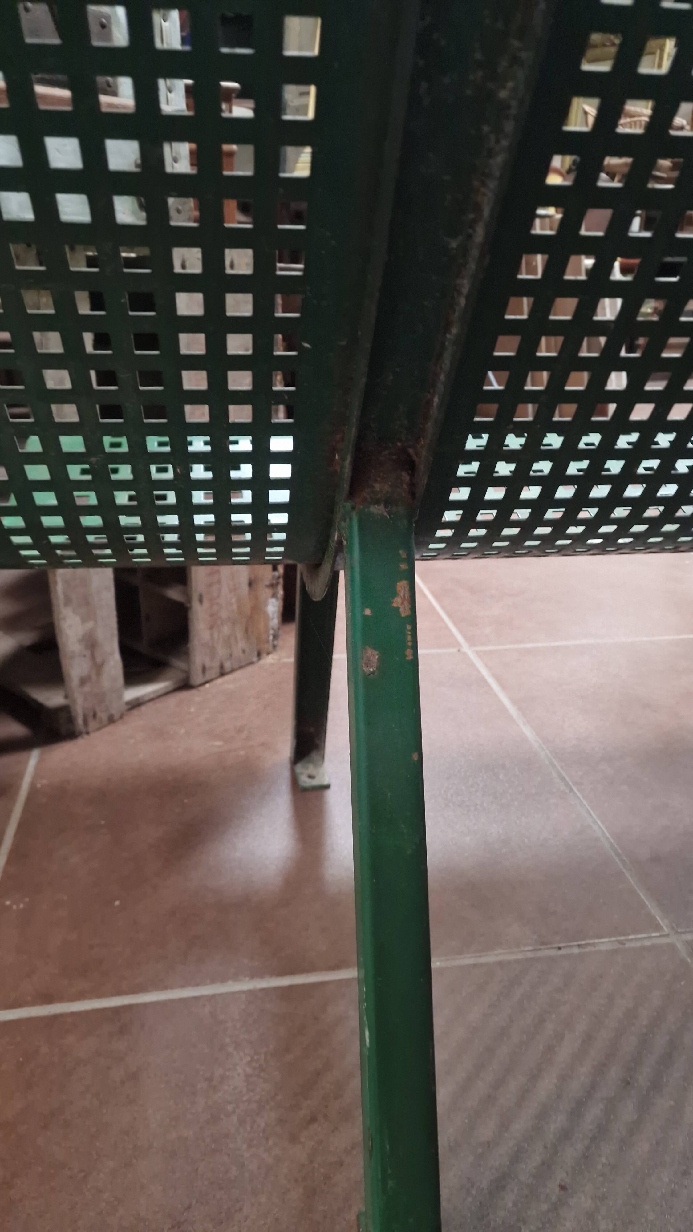 Vintage green perforated metal public bench