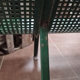 Vintage green perforated metal public bench
