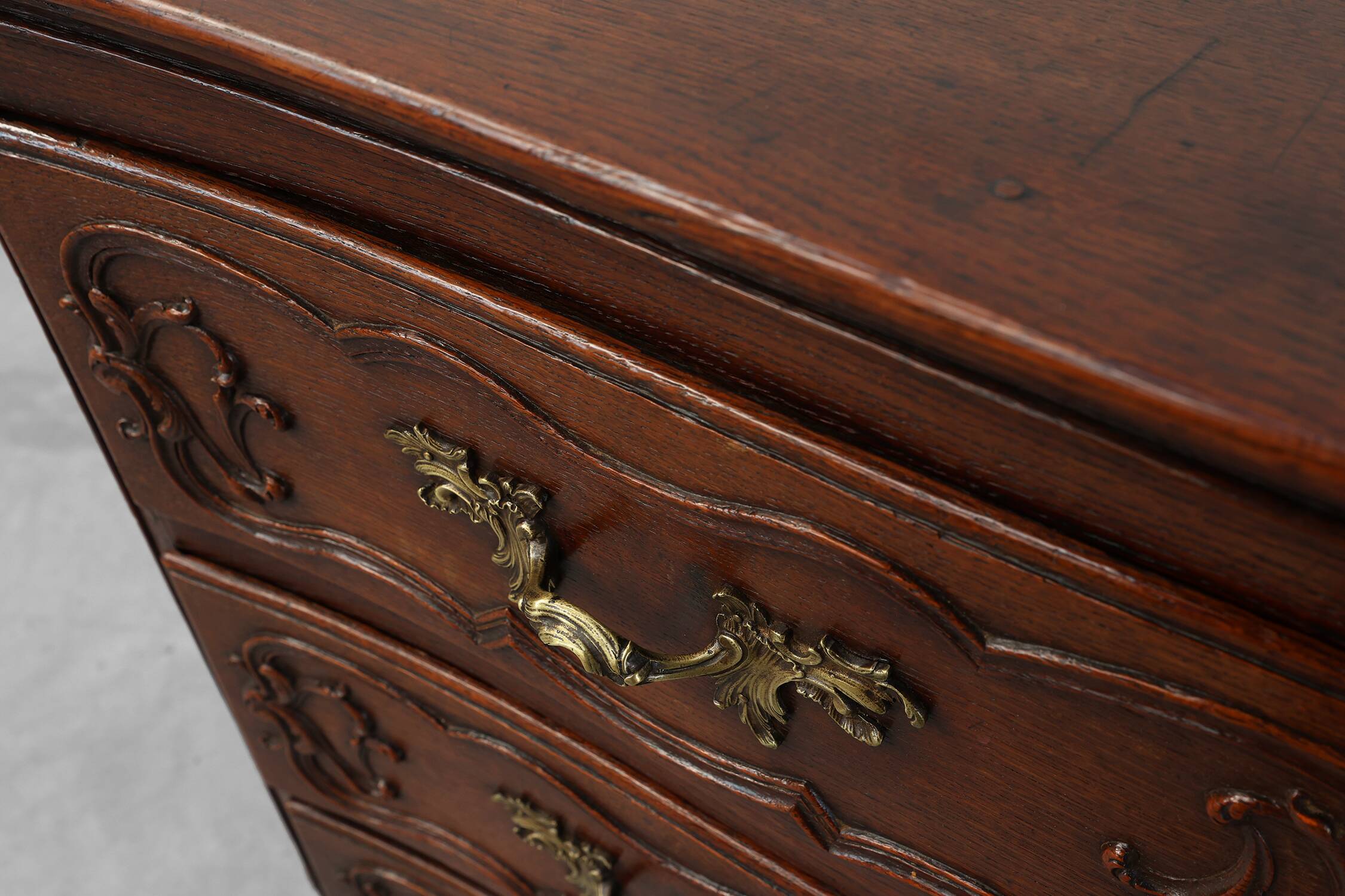 French 18th Century hand crafted oak chest of drawers in Louis XV style