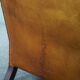 Wingback chair made of sheepskin leather in a light honey color