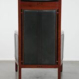 Black Art Deco cowhide leather and wooden design armchair with a high back