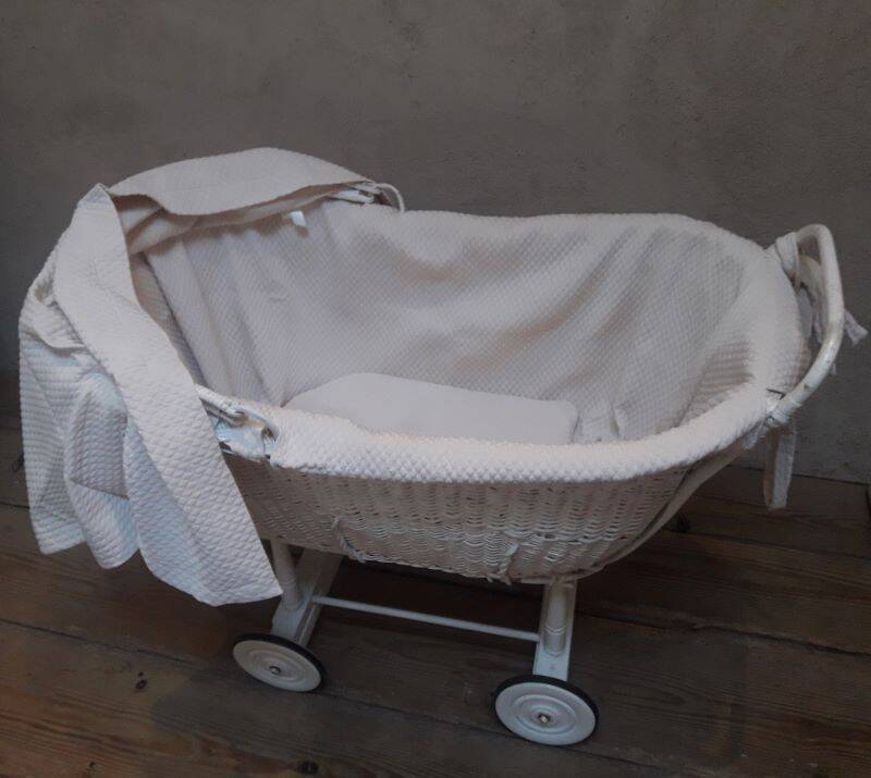 Wicker and painted wood baby cradle