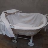 Wicker and painted wood baby cradle