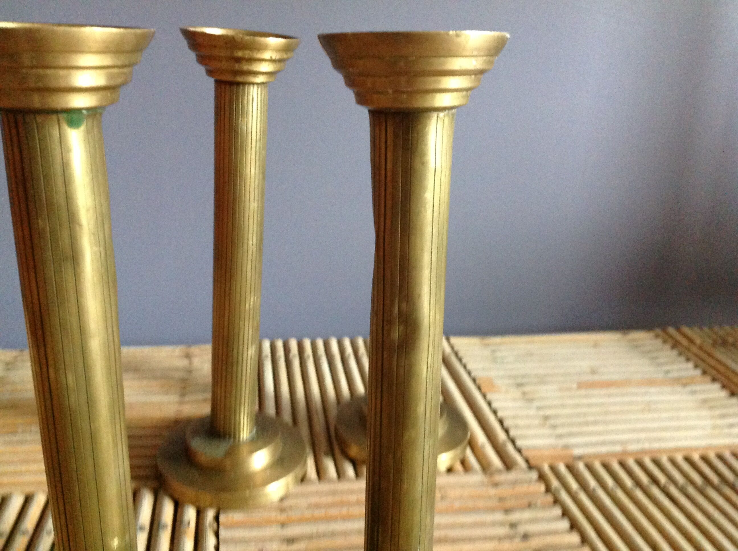 Series of 4 brass candlesticks