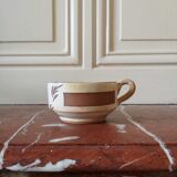 Three large stoneware cups with floral pattern, art deco