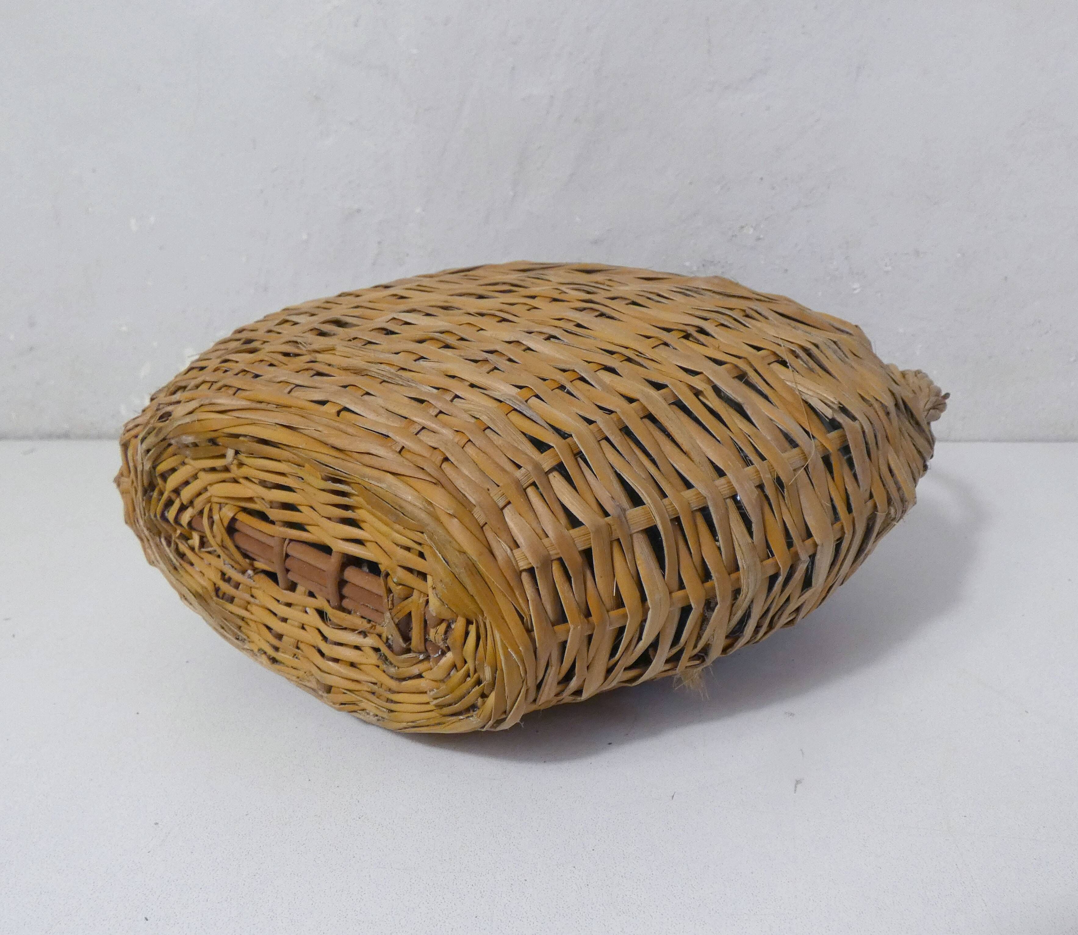 old bottle dressed in rattan vintage pilgrim gourd