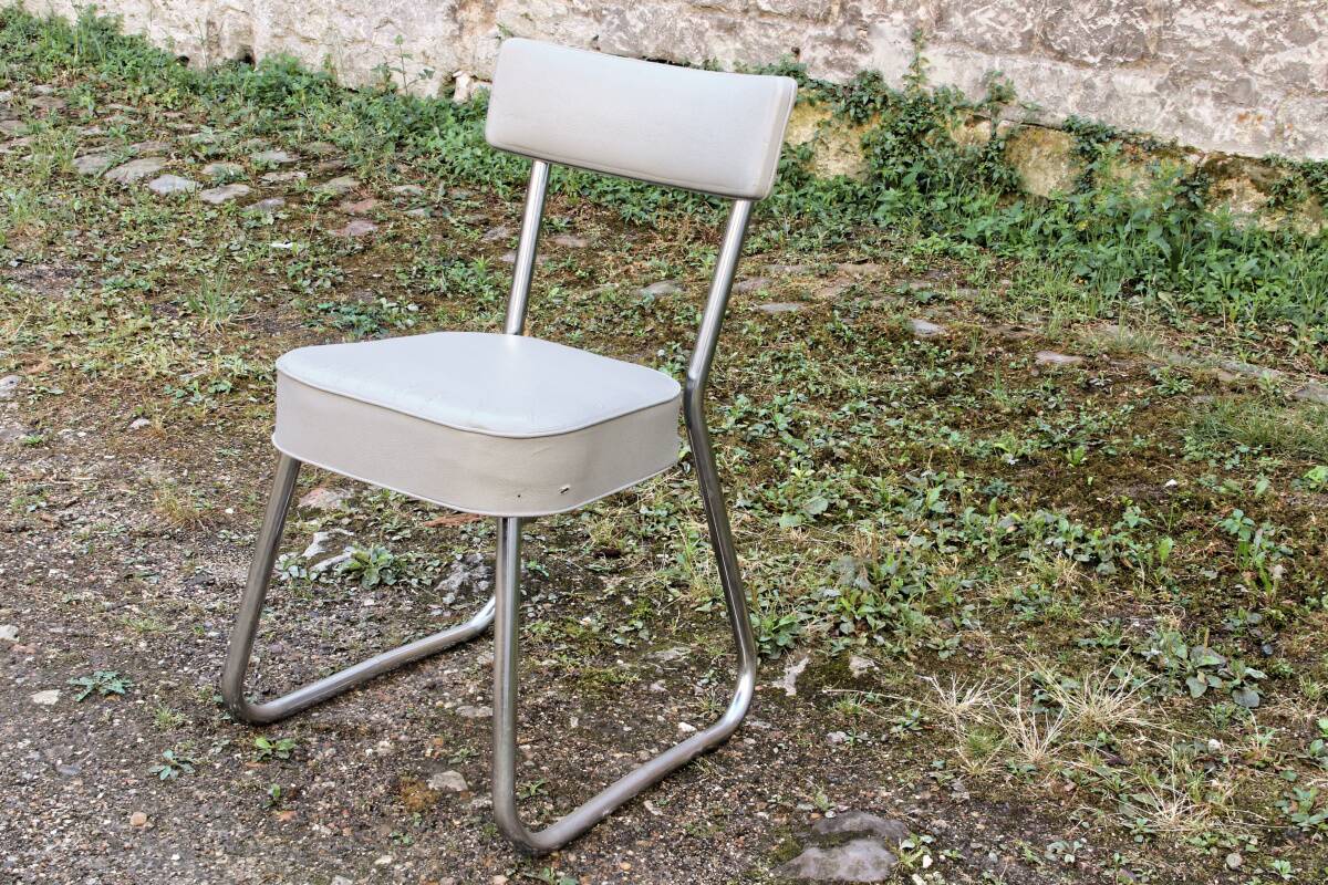 Set of 2 chairs and 1 armchair from the 70s in chrome metal and faux leather.