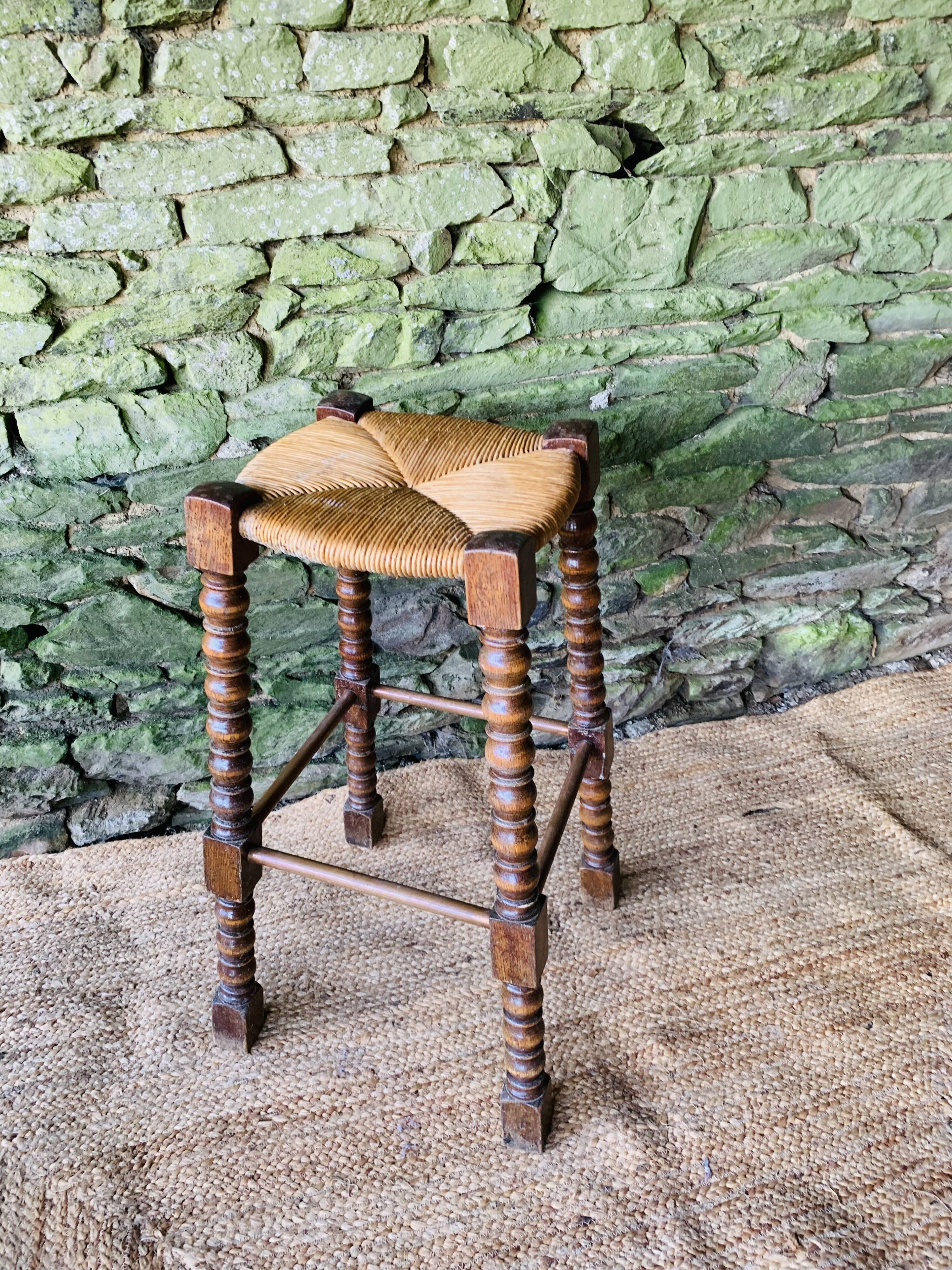 High stool in turned wood
