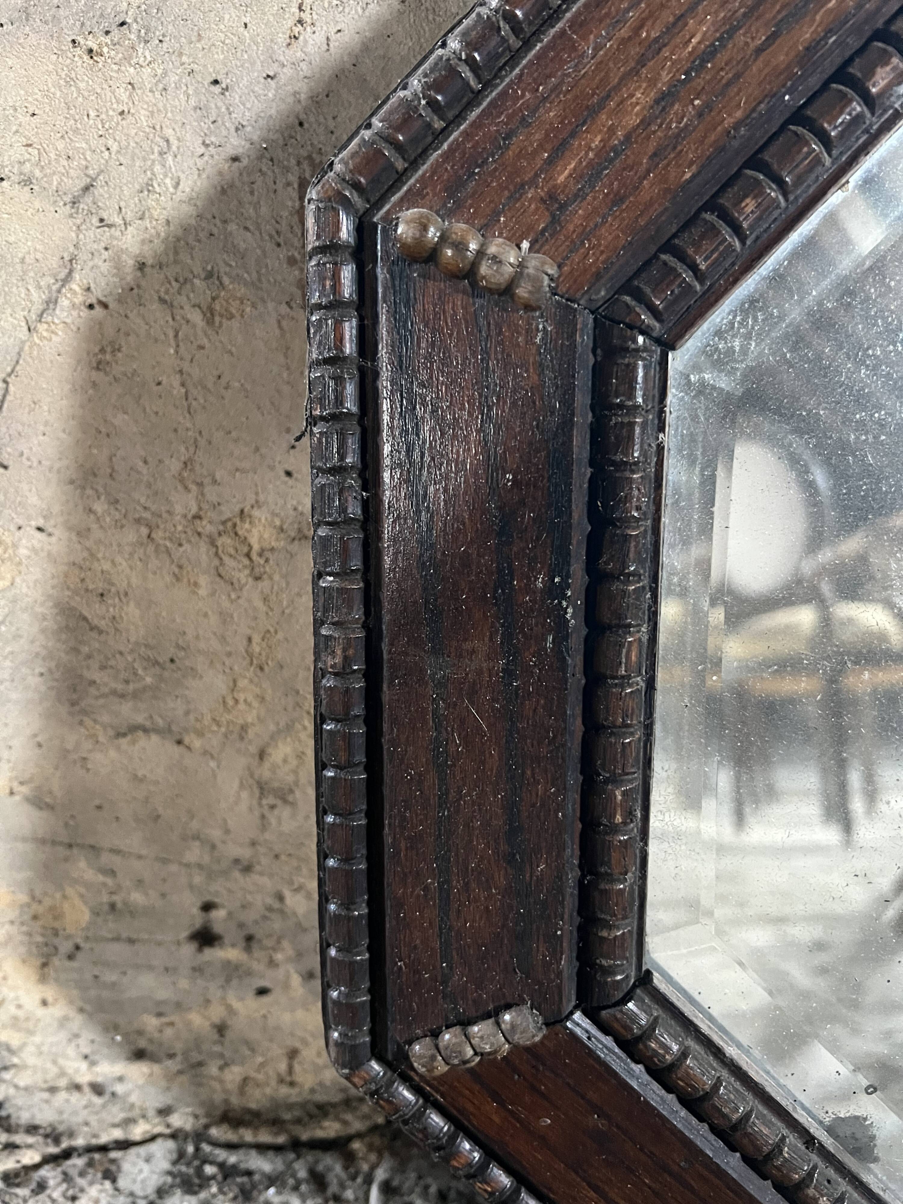 Antique octagonal mirror in dark wood – pearl decoration