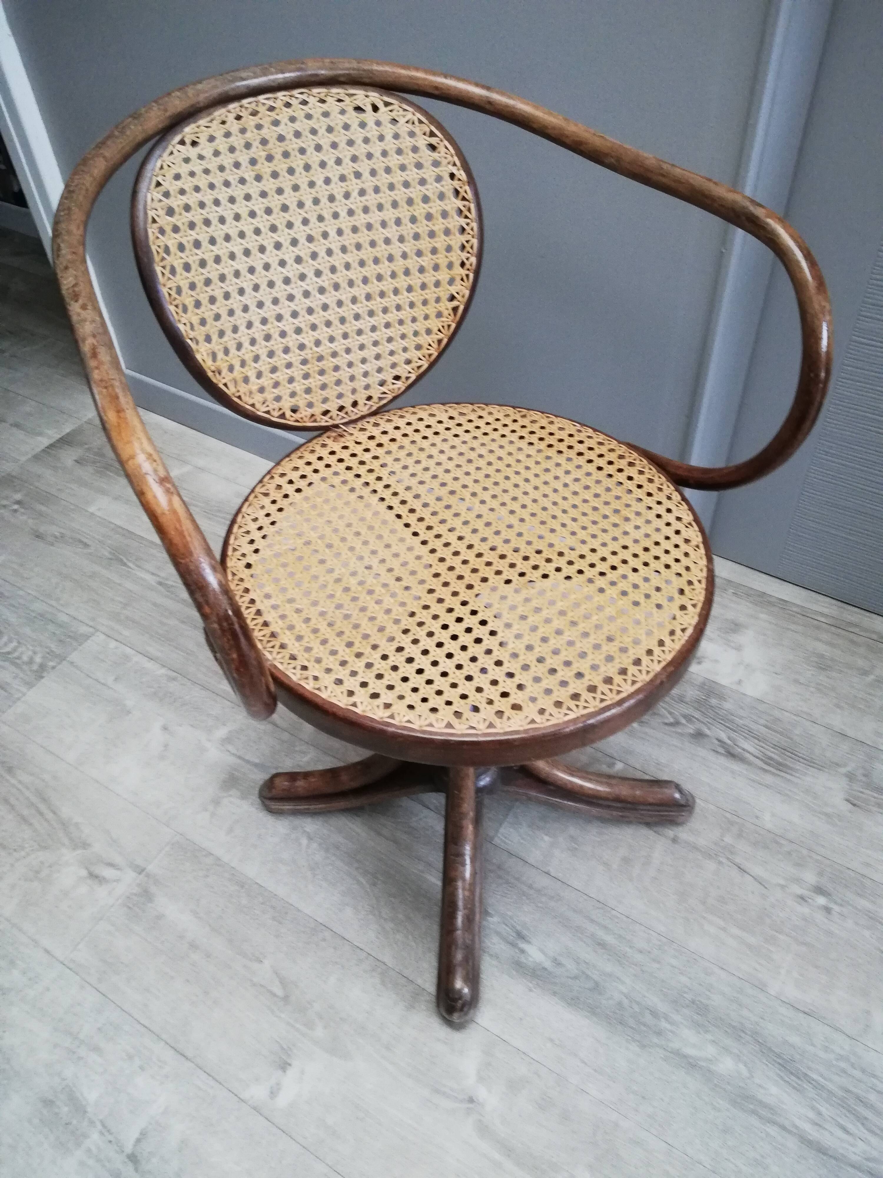 Office chair with curved wood swivel screw and Thonet cannage