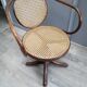 Office chair with curved wood swivel screw and Thonet cannage