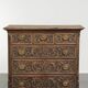 Richly carved English oak chest of drawers from the 18th century