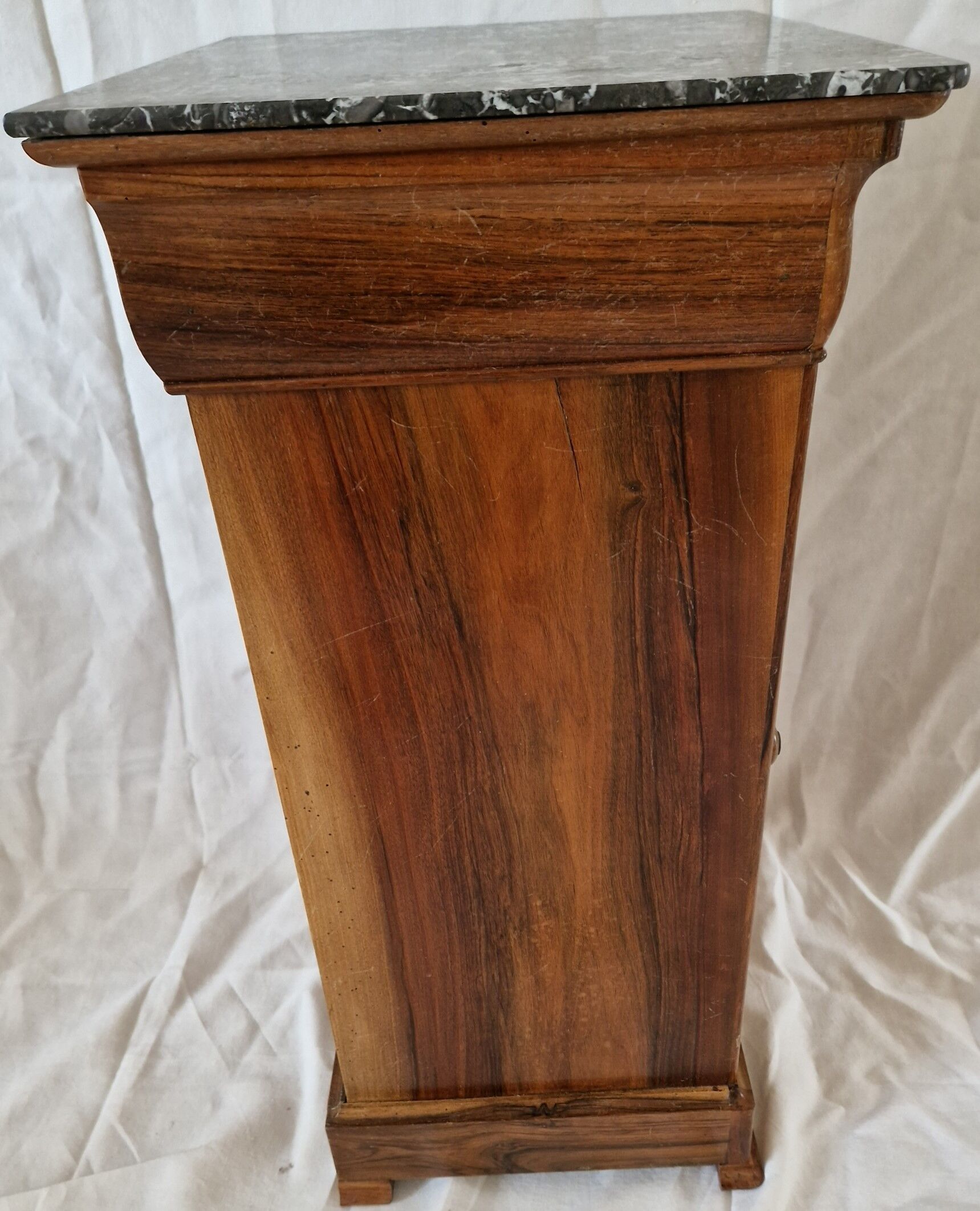 Elegant antique Napoleon III side table in walnut with black marble veneer.