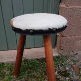 Antique tripod stool in wood and cowhide