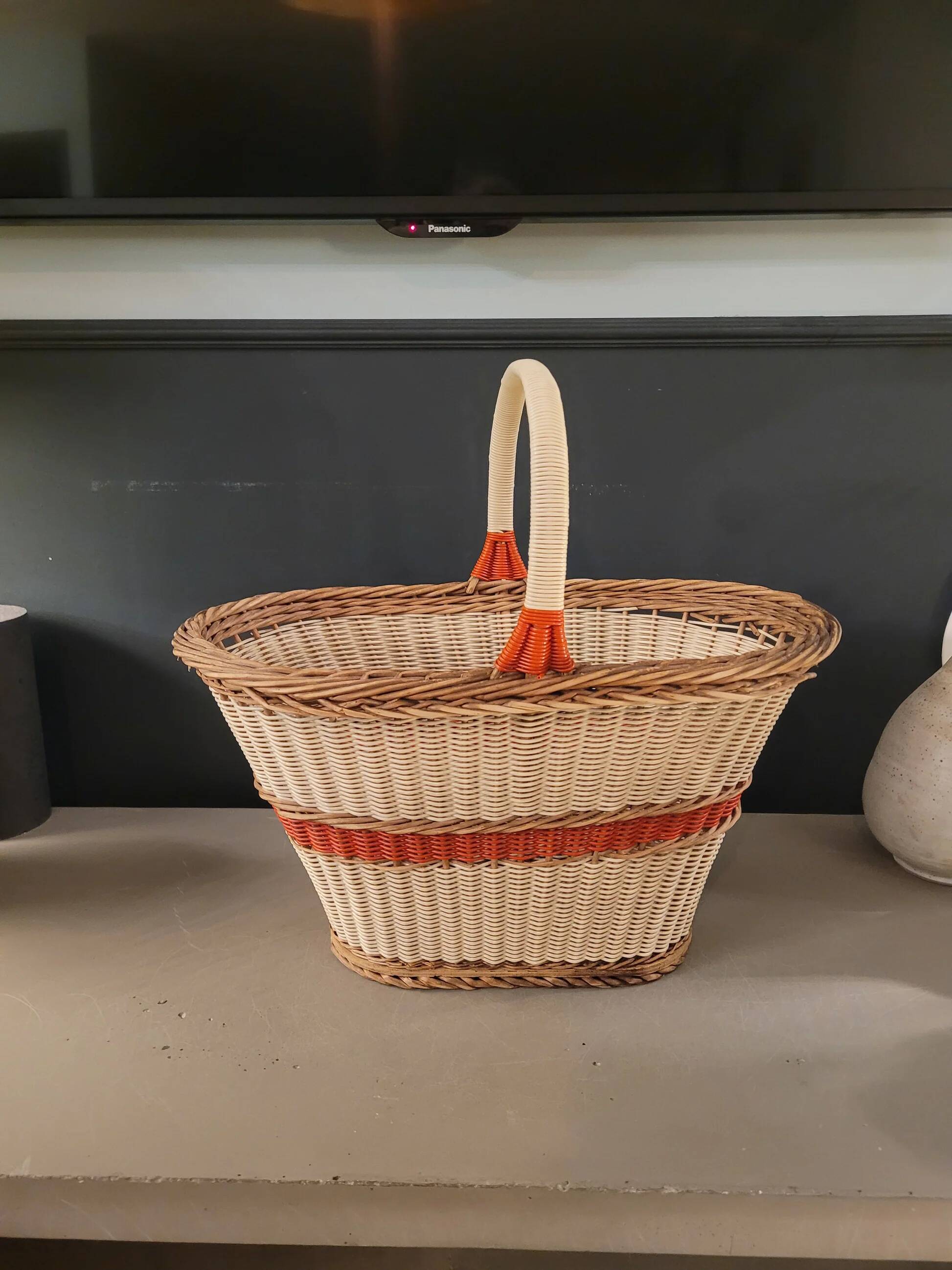 Old oval basket with a wooden base