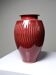 Glazed stoneware vase in oxblood with ribs, workshop work from the 20th century.