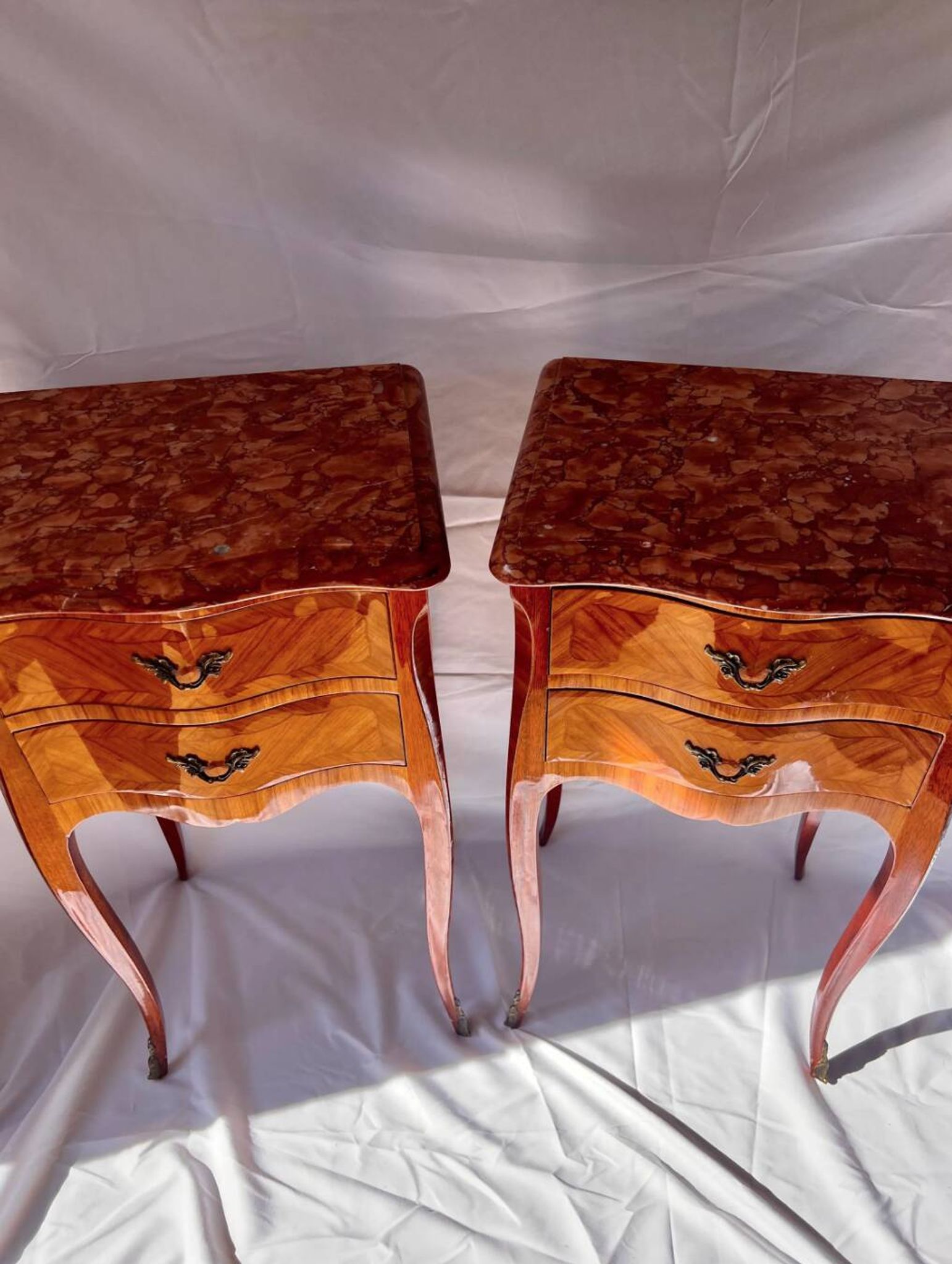 Pair of French rosewood bedside tables, marble top, inlaid beds.