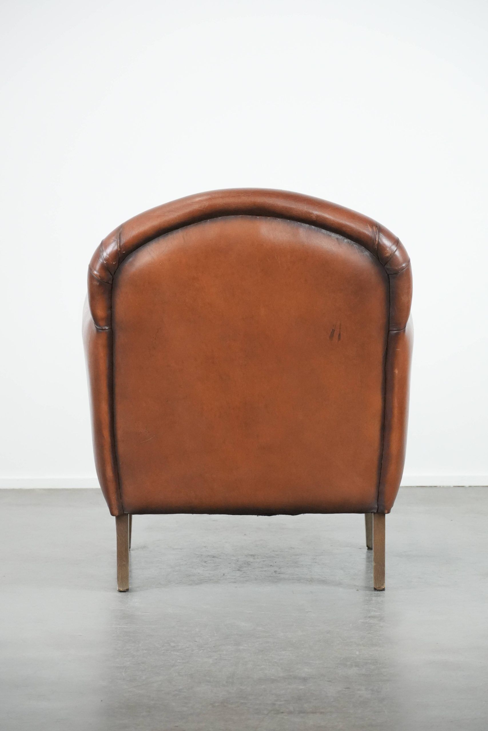 Sheepskin art deco design armchair with timeless and warm colours