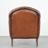 Sheepskin art deco design armchair with timeless and warm colours