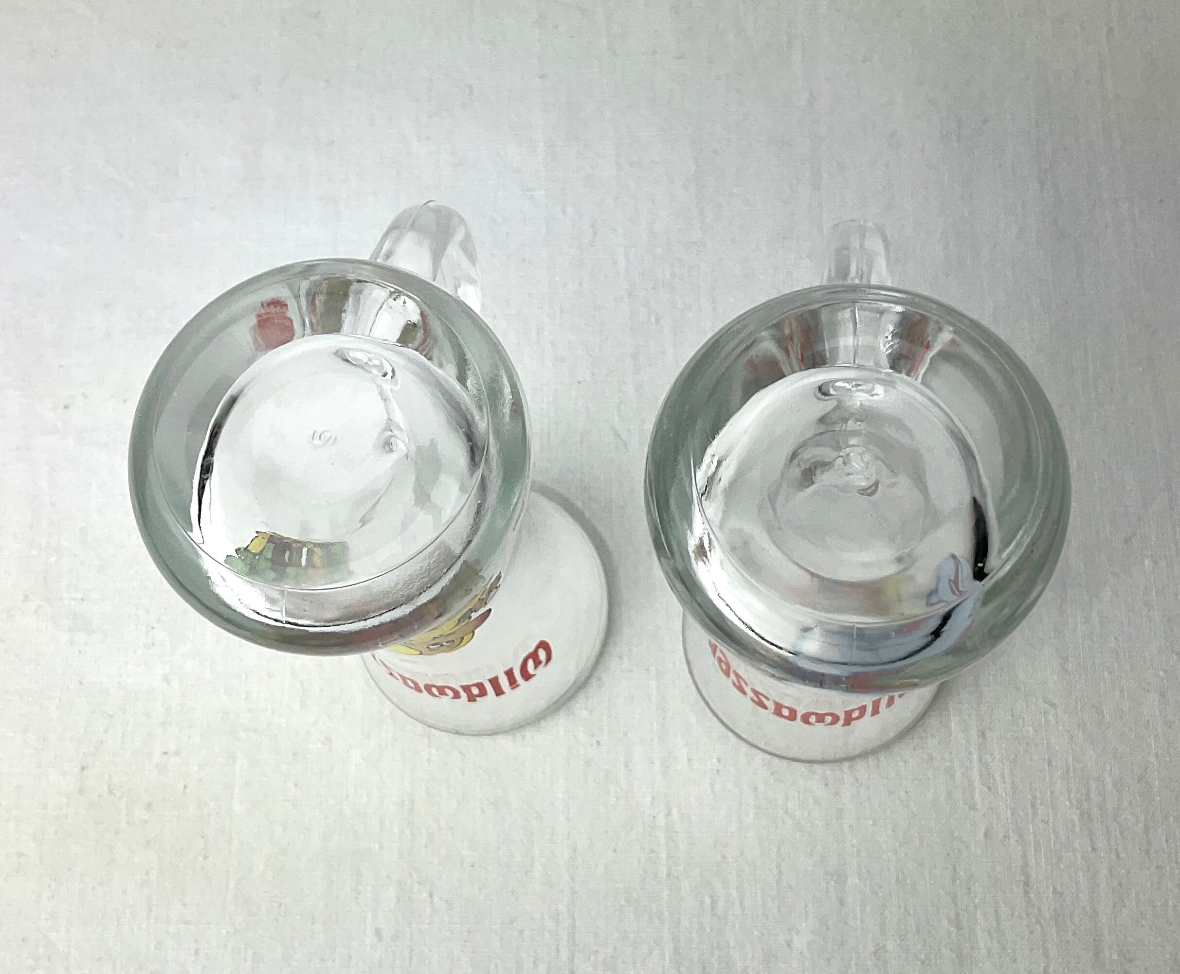 Pair of vintage illustrated spirits glasses Wildwasser