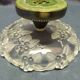 Fruit cut in glass foot silver metal