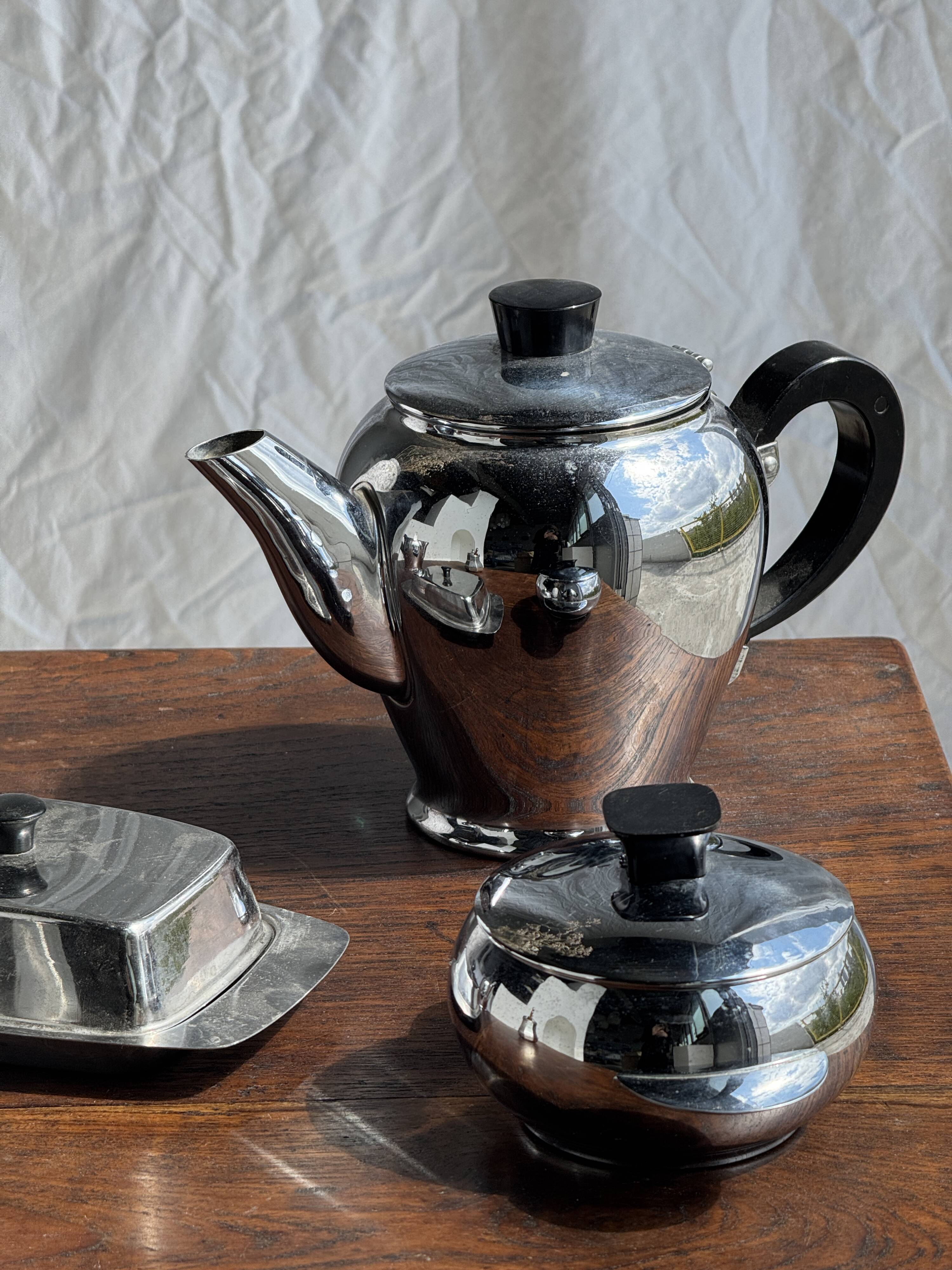 Tea set including teapot, milk jug, sugar bowl and butter dish