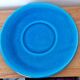Blue ceramic soup tureen and crackled finish trivet.