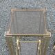 Pair of Hollywood Regency side tables in gold metal and smoked glass.