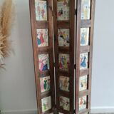 Wooden screen with vintage haute couture images or for photos