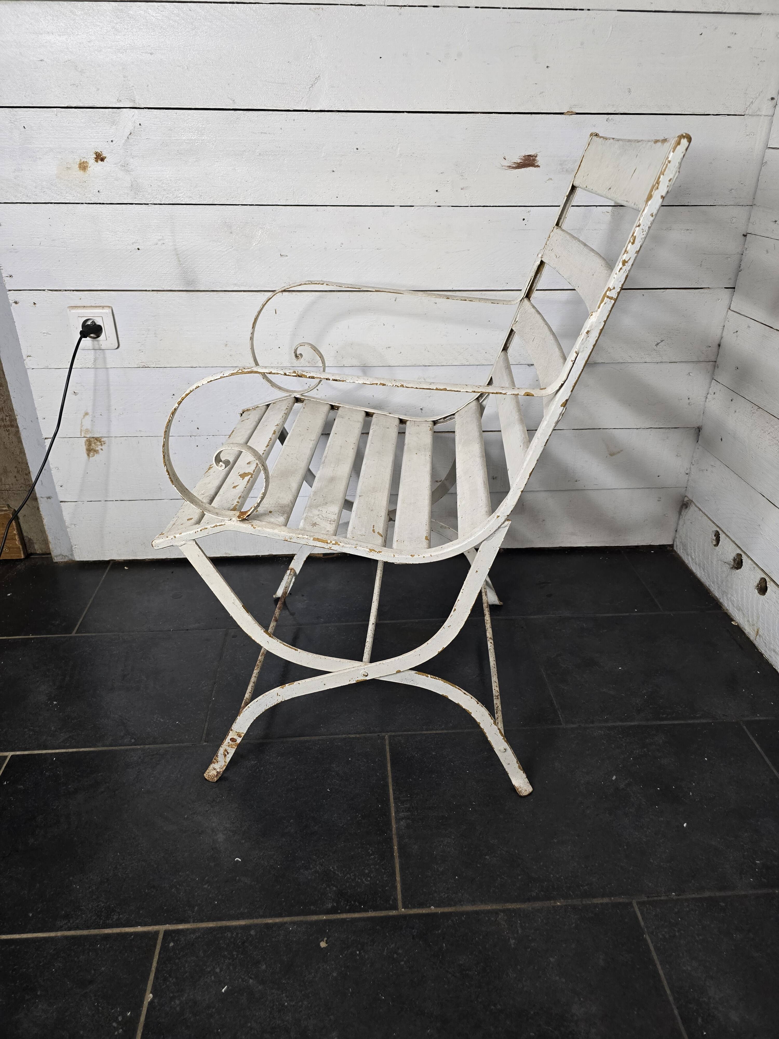 Old wrought iron and wood garden armchair