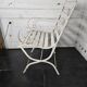 Old wrought iron and wood garden armchair