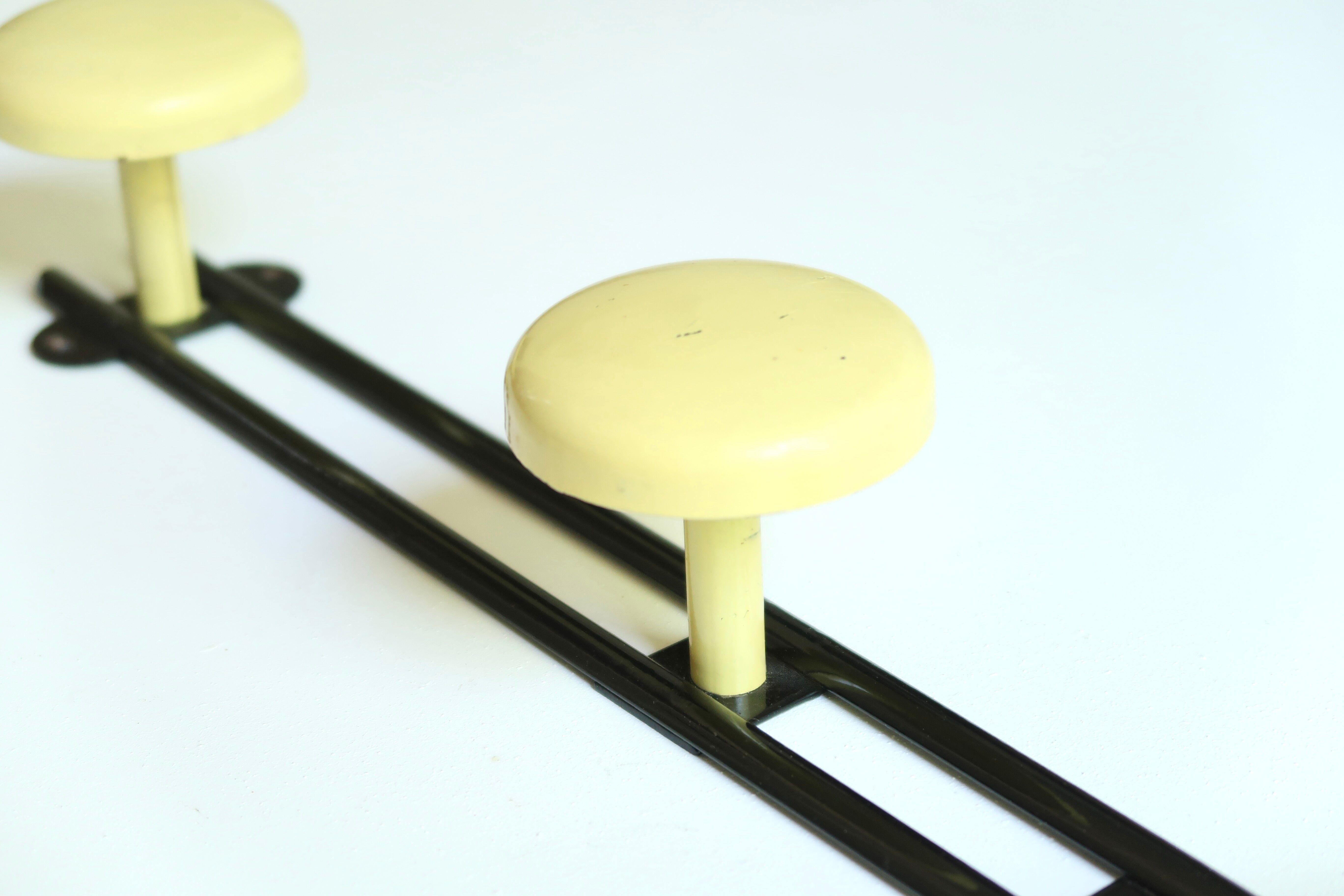 Black and yellow metal coat rack, 50s