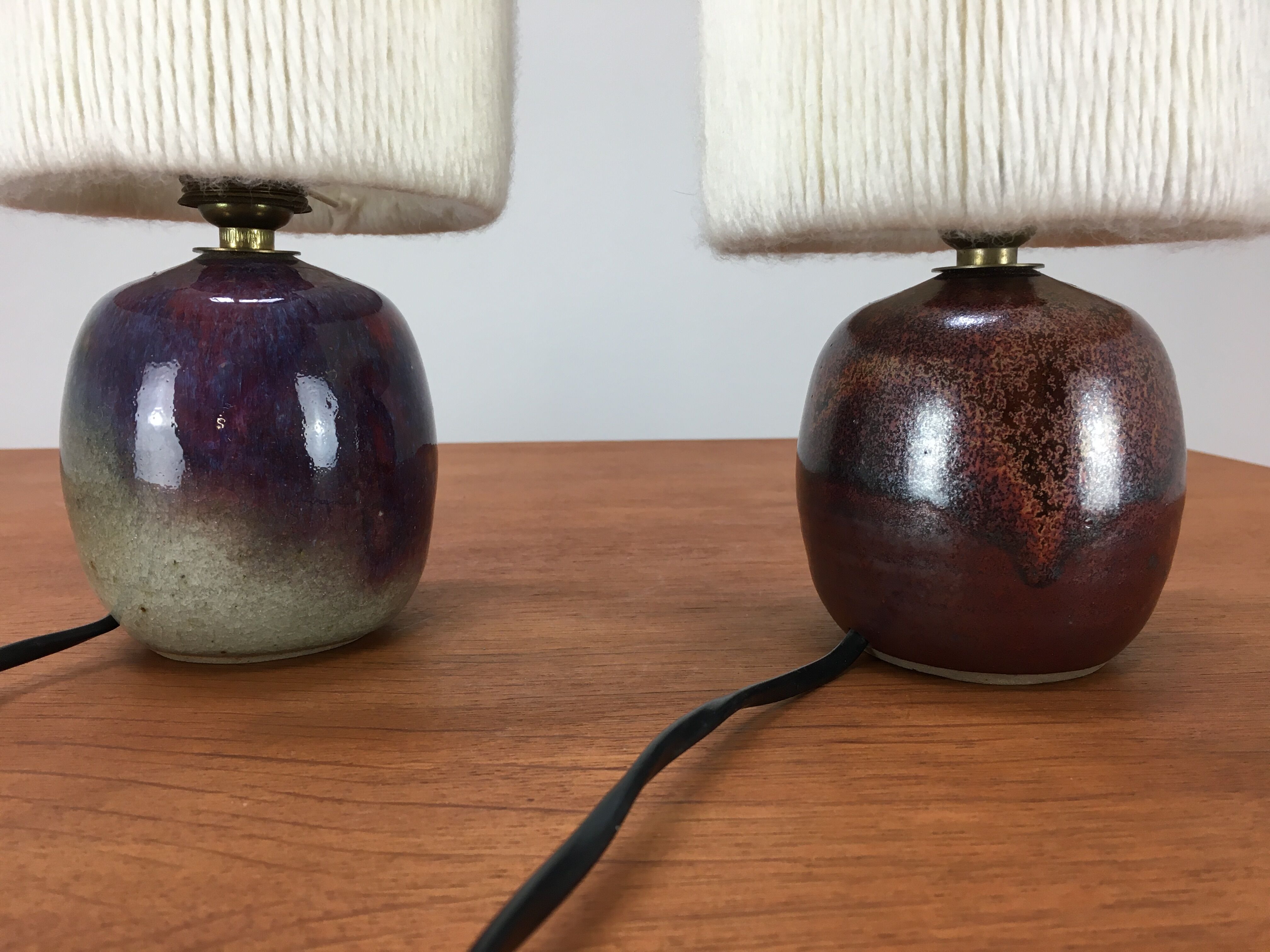 Pair of ceramic sandstone ball lamps and wool lampshades