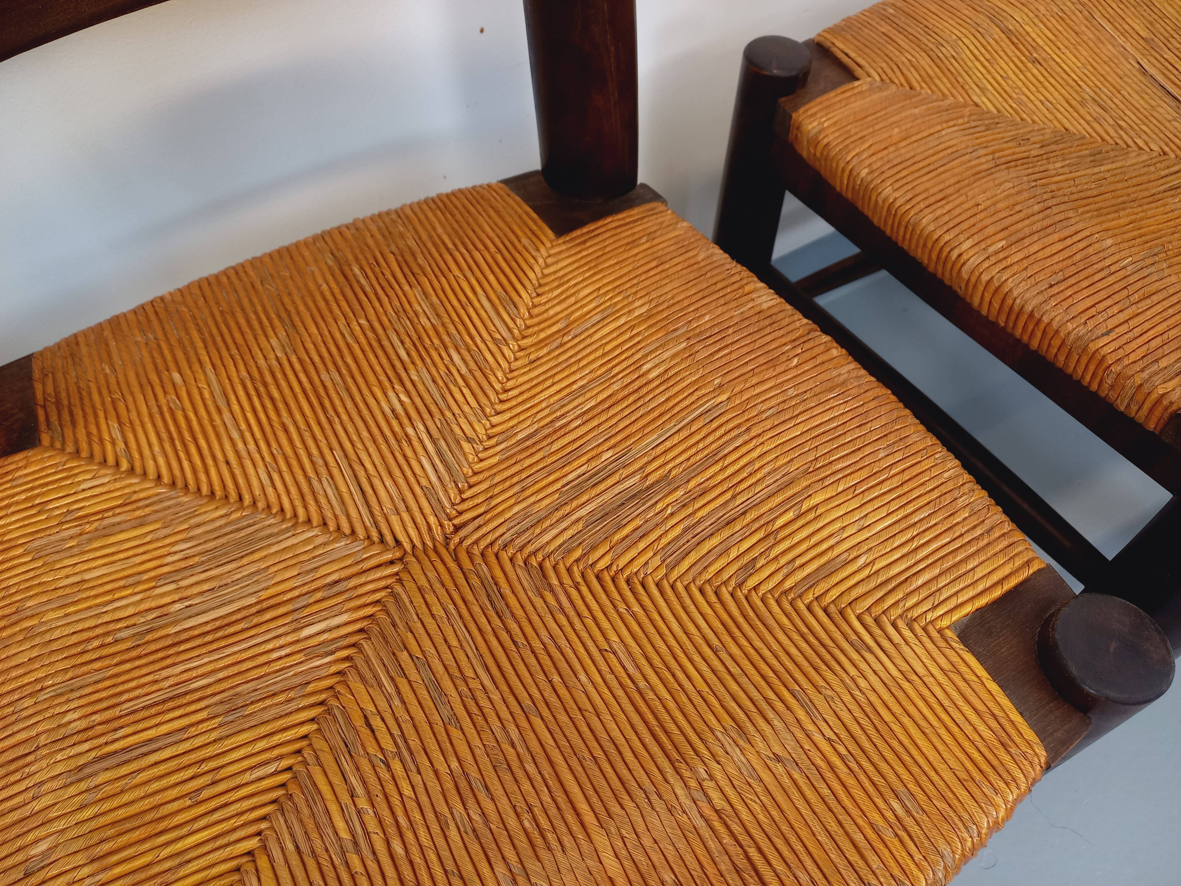Set of 4 vintage brutalist chairs by Georges Robert in wood and straw.