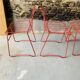 4 red design chairs