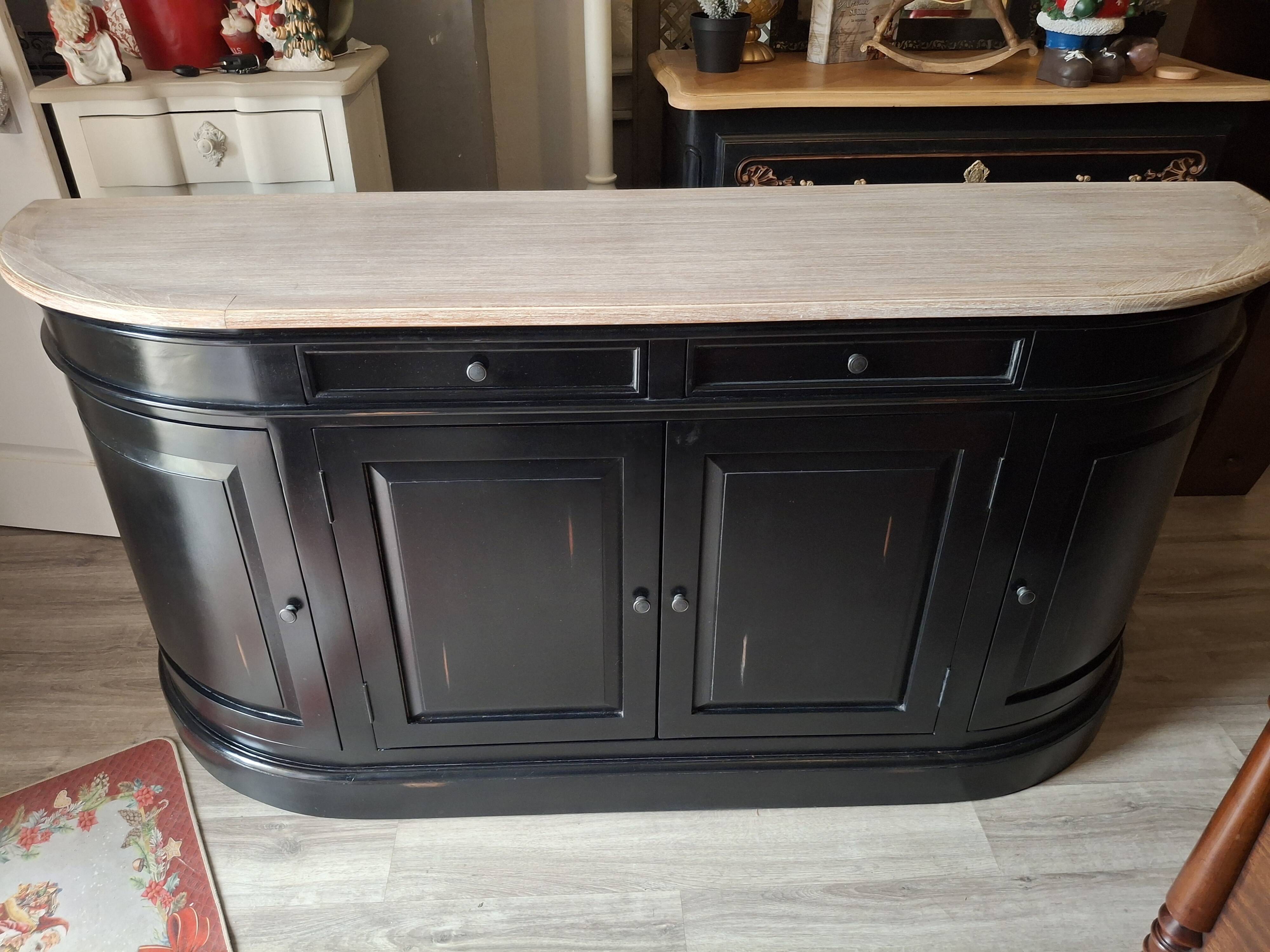 Black sideboard with curved sides and wooden top