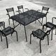 Set of 6 armchairs and perforated metal table from the 1950s.