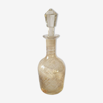 Yellow carafe in chiseled glass