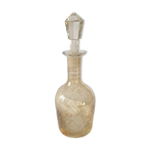 Yellow carafe in chiseled glass