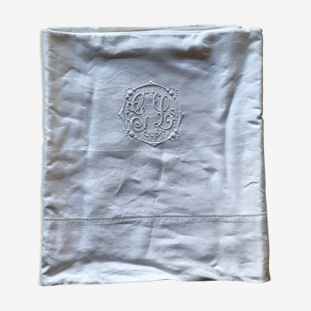 Antique sheets. Monogram in white embroidery.