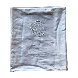 Antique sheets. Monogram in white embroidery.