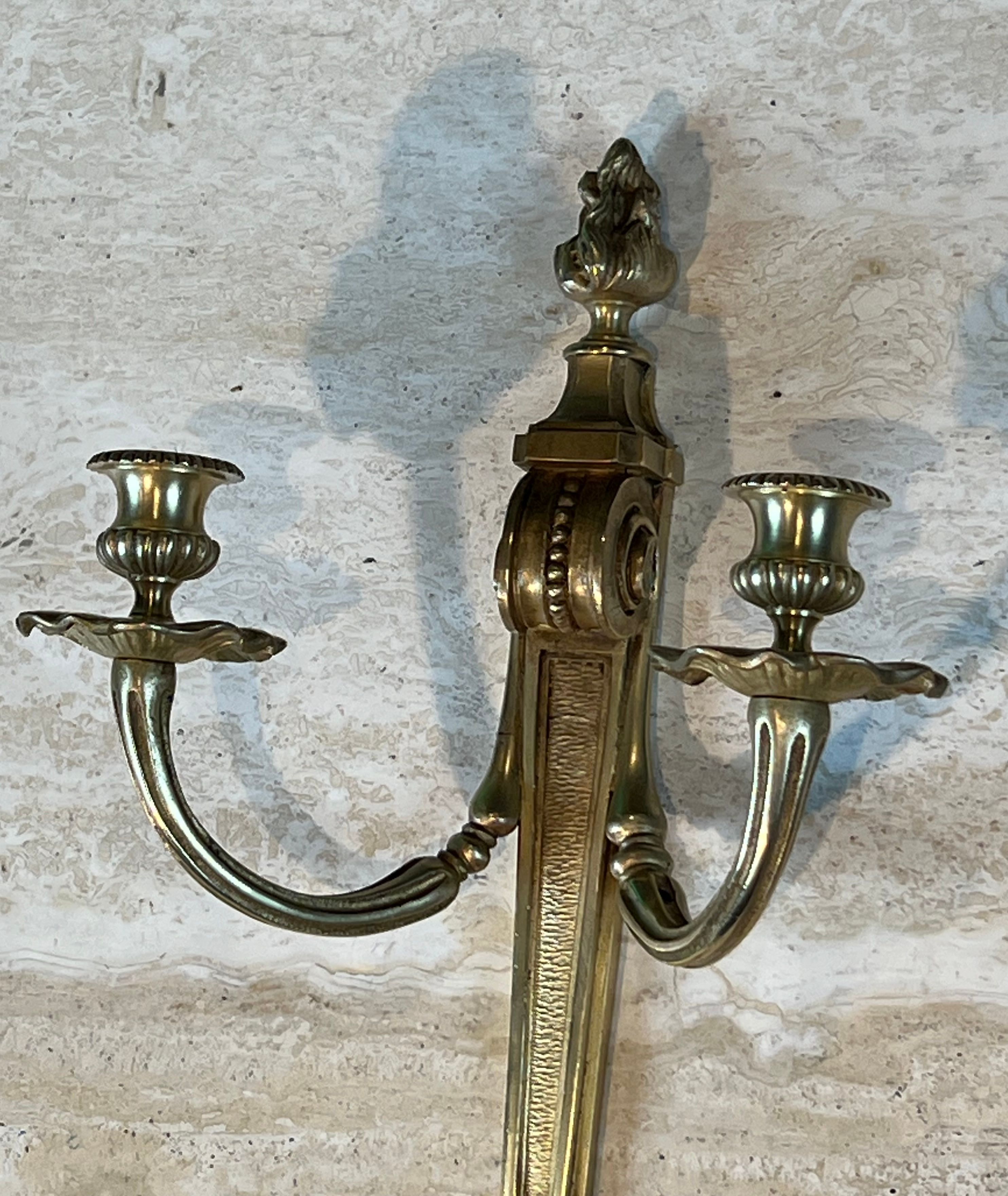 Pair of Louis XVI style bronze wall sconces