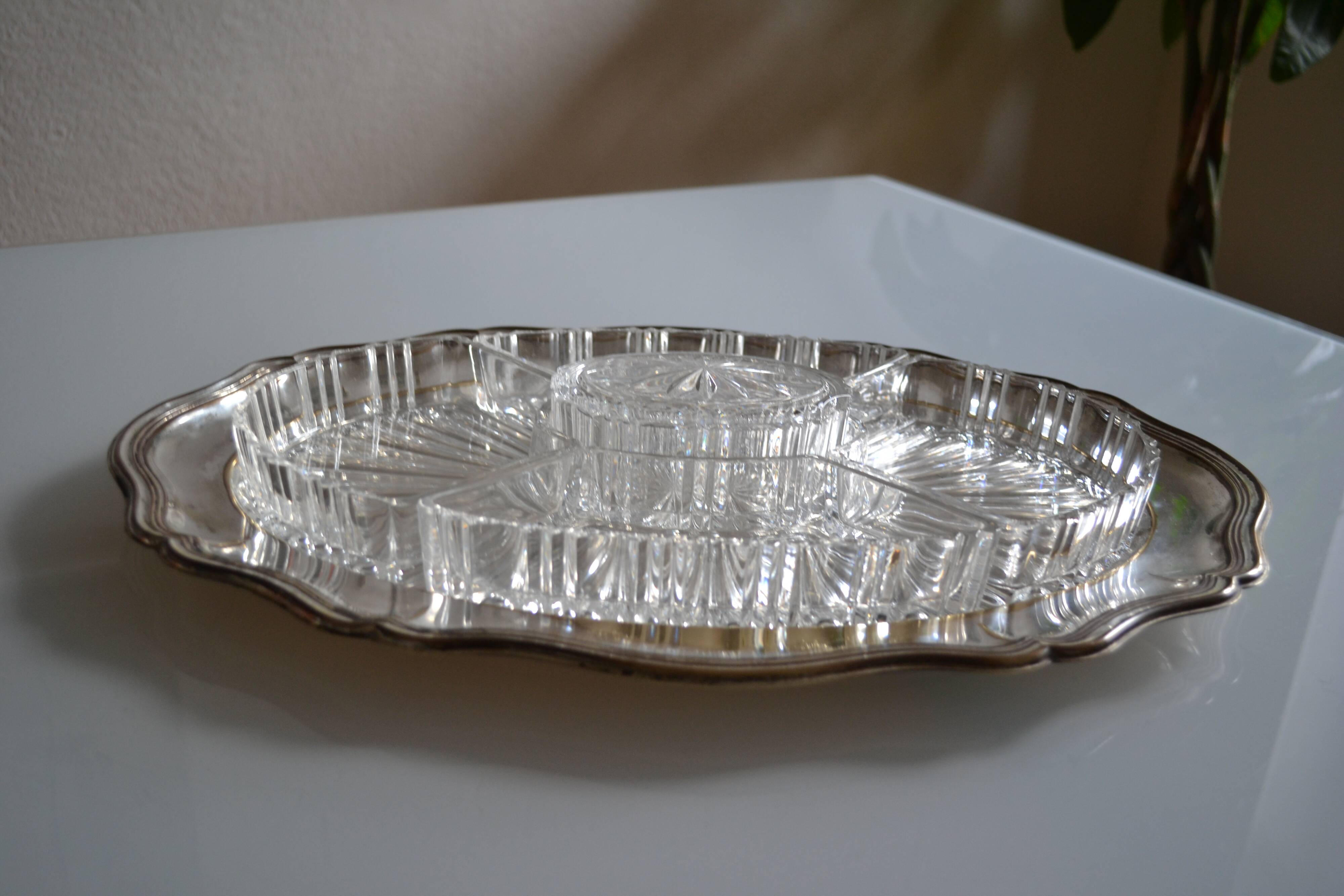 Silver-plated metal aperitif serving tray with HKE hallmark and glass.