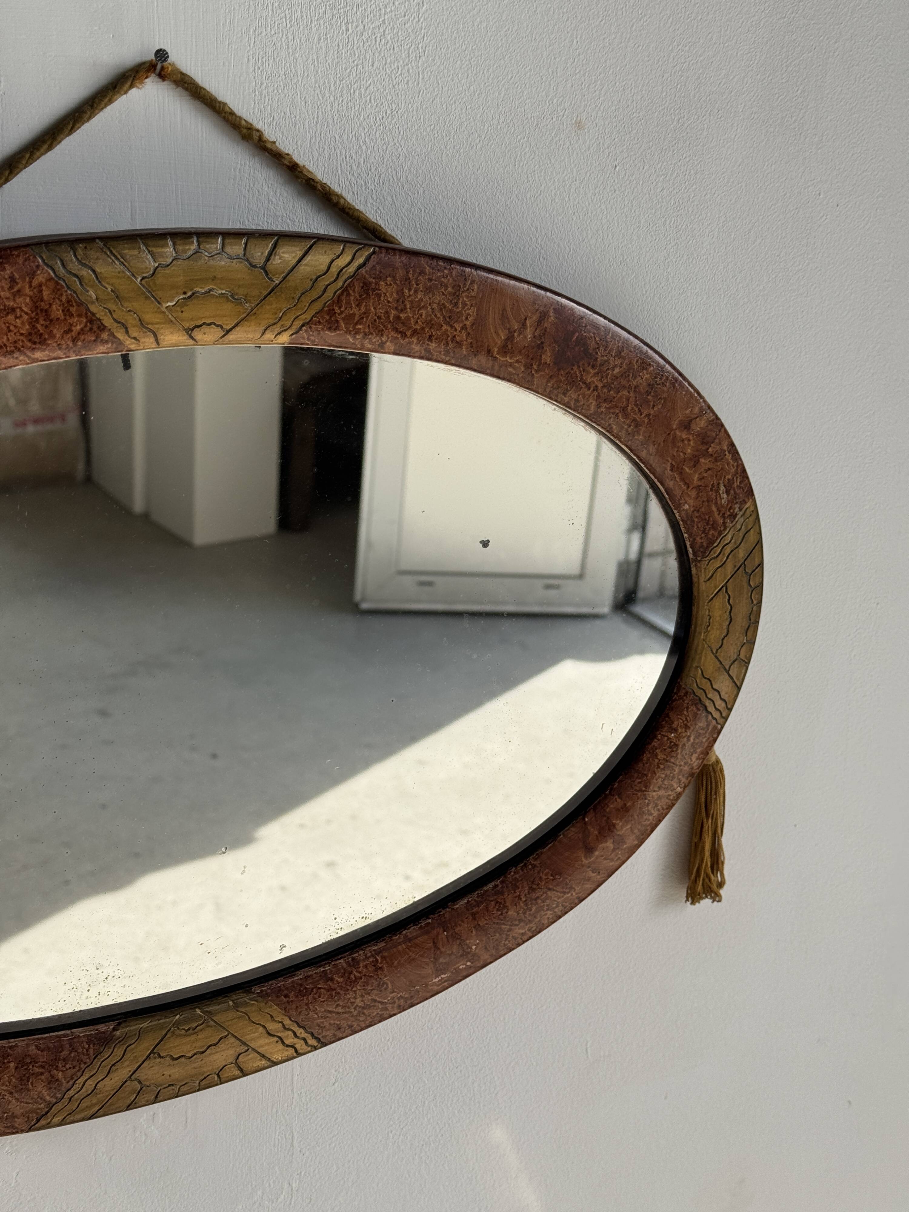 Small oval Art Deco mirror in brown and gold 33x54.