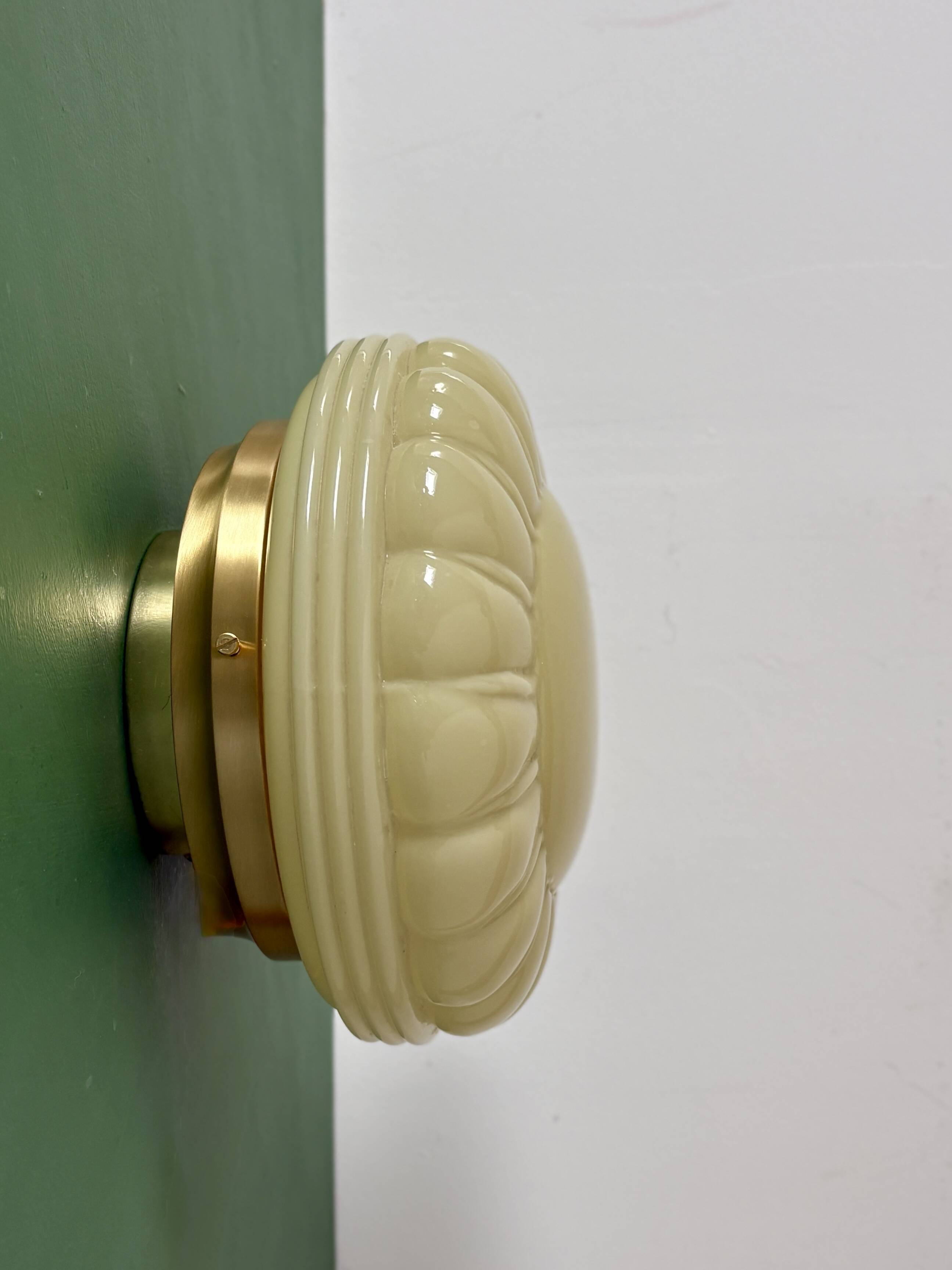 Vintage Art Deco globe wall or ceiling light in yellow opaline.