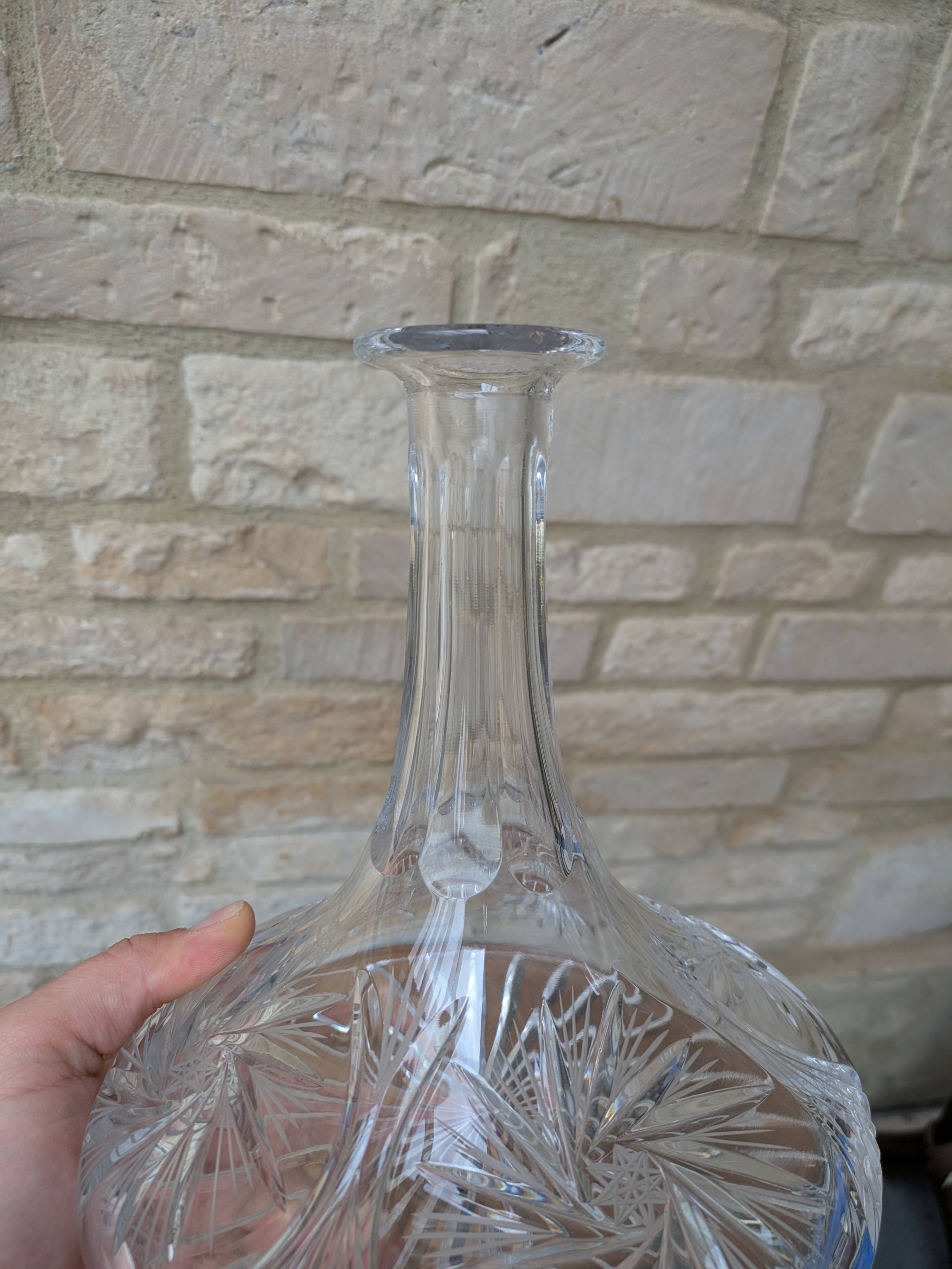 Antique cut crystal decanter with stopper.