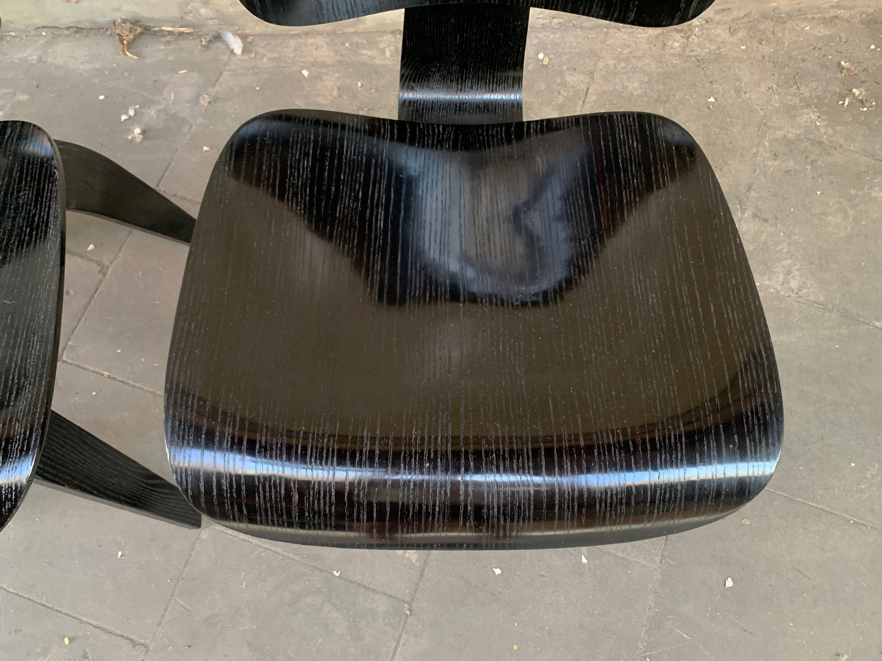 Pair of DCW chairs by Charles & Ray Eames in Black for Herman Miller 1950