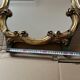 Large wall mirror with a gilded brass frame in Louis XV style.