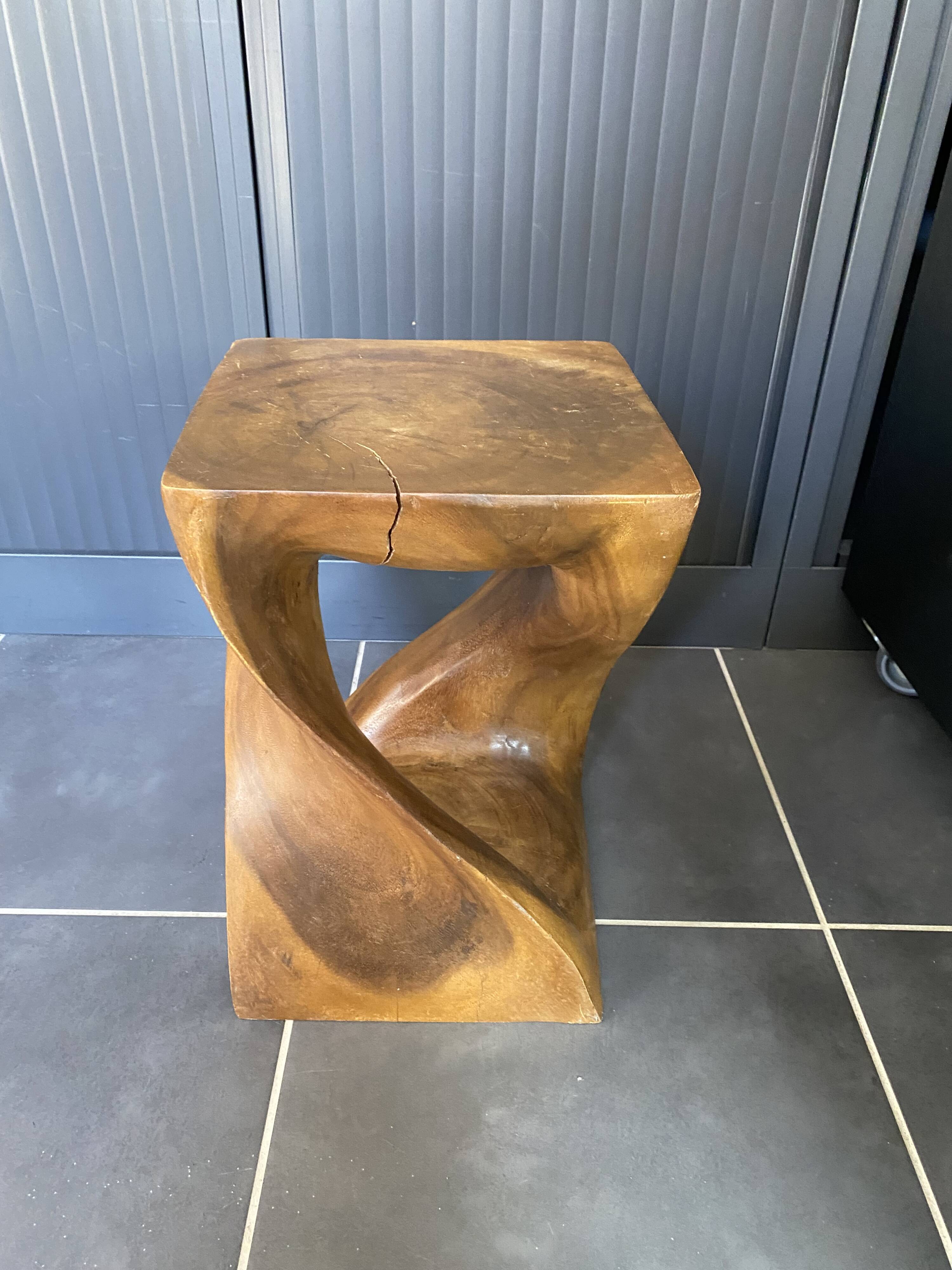 Stool no. 1 in solid raw walnut wood, carved from the mass, 1970.
